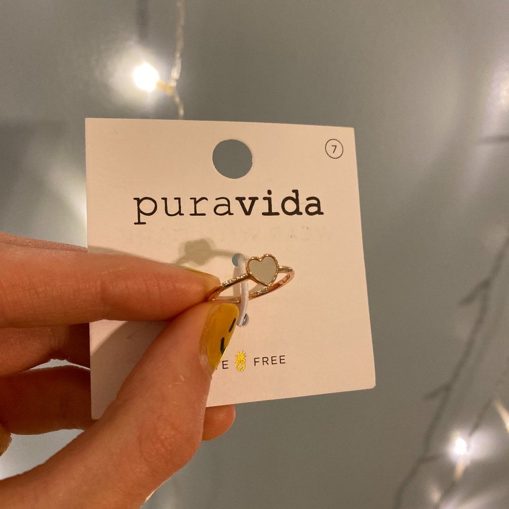 white and gold ring from puravida